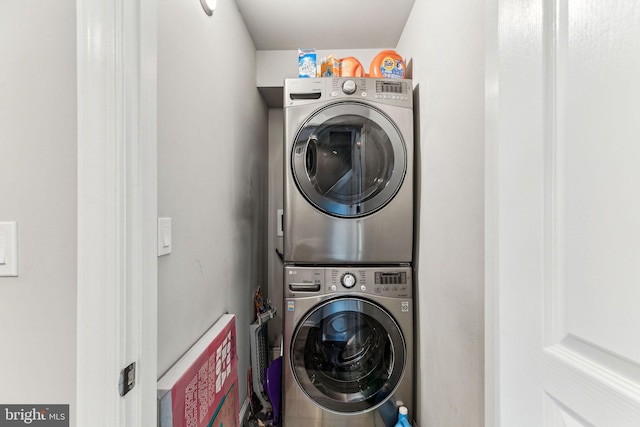 laundry room featuring laundry area and stacked washing maching and dryer