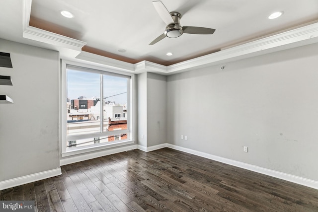 unfurnished room with dark wood-style floors, recessed lighting, baseboards, and crown molding