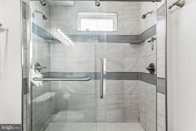 bathroom with a shower stall