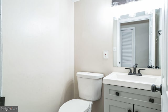 half bath with toilet and vanity