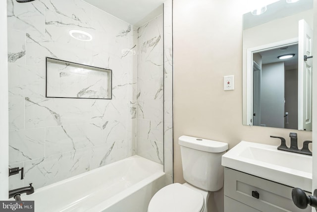 bathroom with toilet, shower / washtub combination, and vanity