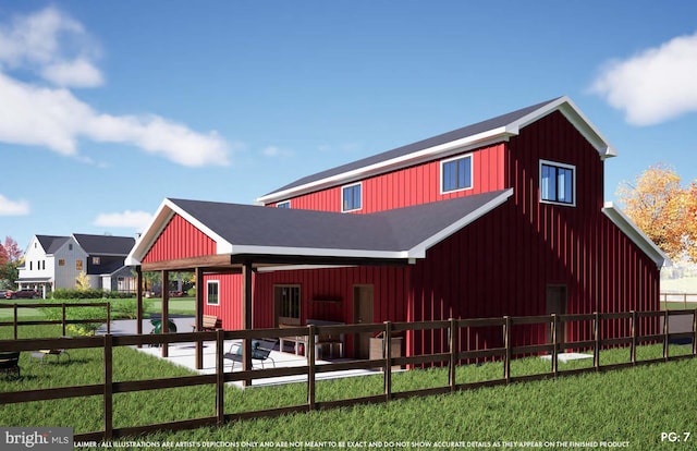 rear view of house with a patio area, board and batten siding, and a yard