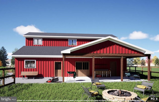 rear view of property with an outdoor fire pit, fence, a yard, a patio area, and board and batten siding