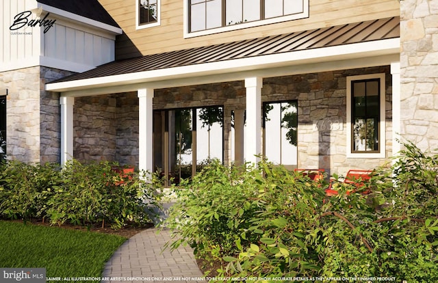 property entrance featuring metal roof, a standing seam roof, stone siding, and board and batten siding