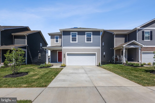 view of front of house with an attached garage, concrete driveway, and a front yard