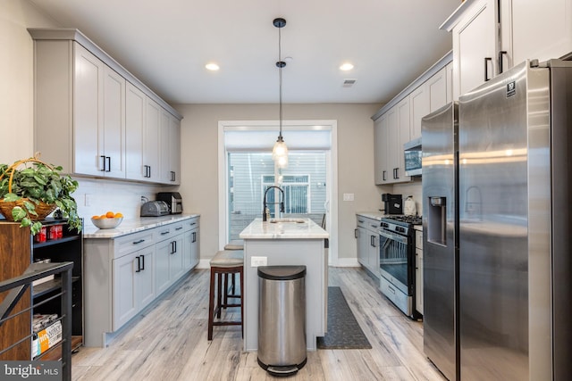 2525 N Hancock St, Philadelphia, PA 19133 - kitchen with appliances with stainless steel finishes, a sink, backsplash, and light stone counters