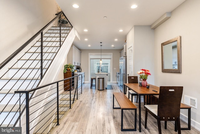 2525 N Hancock St, Philadelphia, PA 19133 - dining room with baseboards, recessed lighting, visible vents, and light wood-style floors