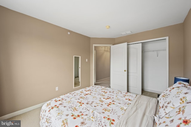 bedroom featuring light carpet, a closet, visible vents, and baseboards