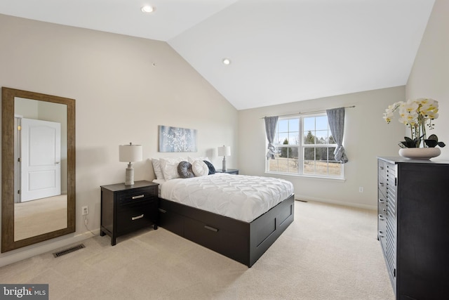 bedroom featuring high vaulted ceiling, baseboards, visible vents, and light colored carpet