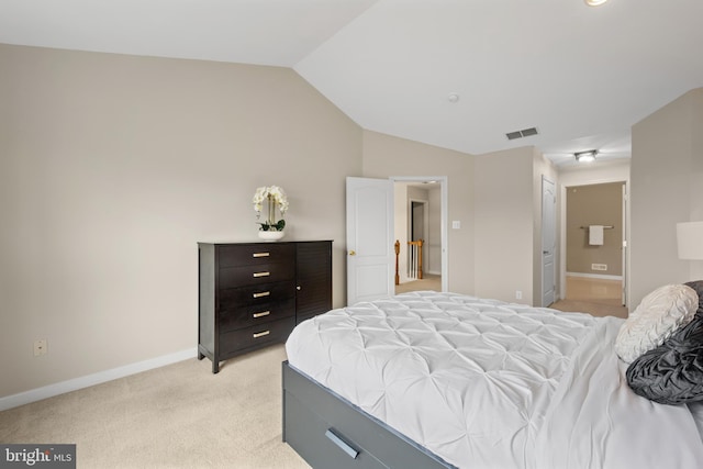 bedroom with lofted ceiling, baseboards, visible vents, and light colored carpet