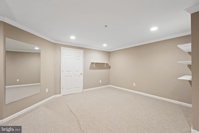 below grade area with carpet, ornamental molding, baseboards, and recessed lighting