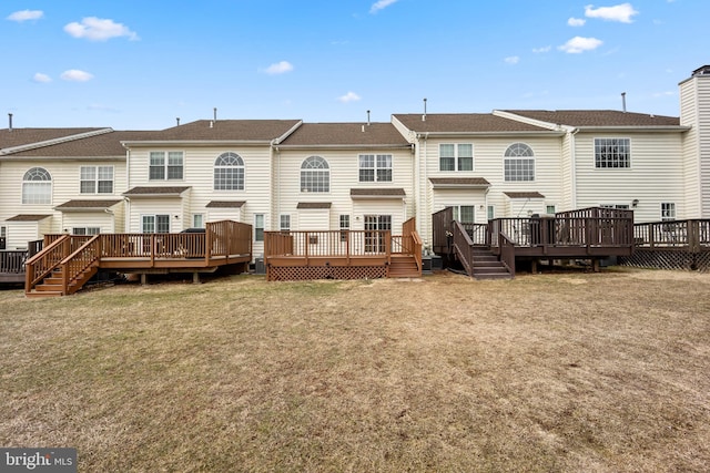 rear view of house with a lawn