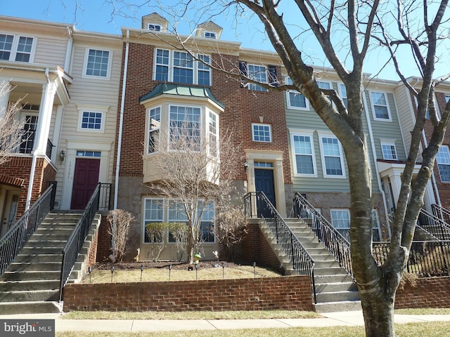 view of property featuring brick siding