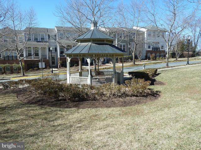 view of community with a residential view, a lawn, and a gazebo