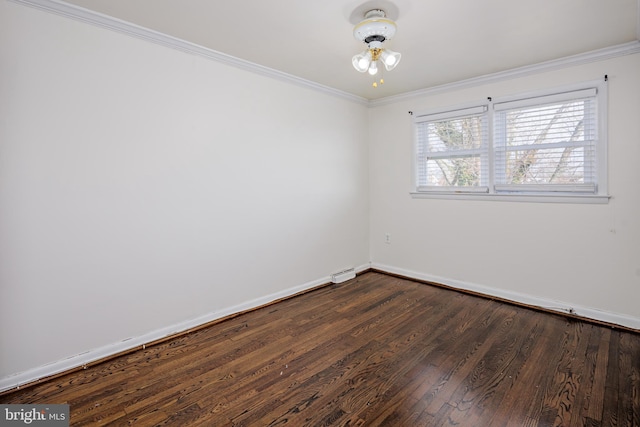 unfurnished room featuring dark wood-style floors, crown molding, and baseboards