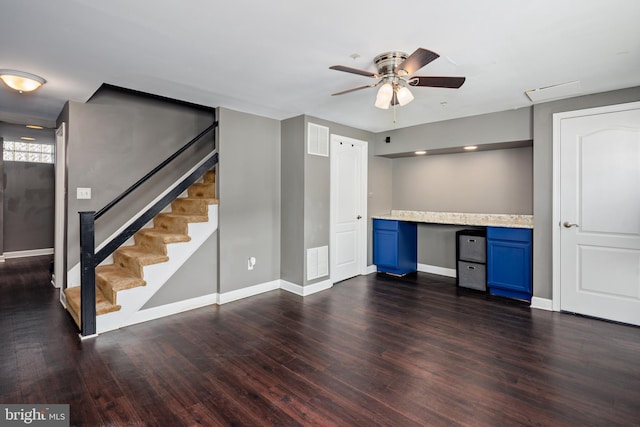 interior space with visible vents, dark wood-style flooring, and built in study area