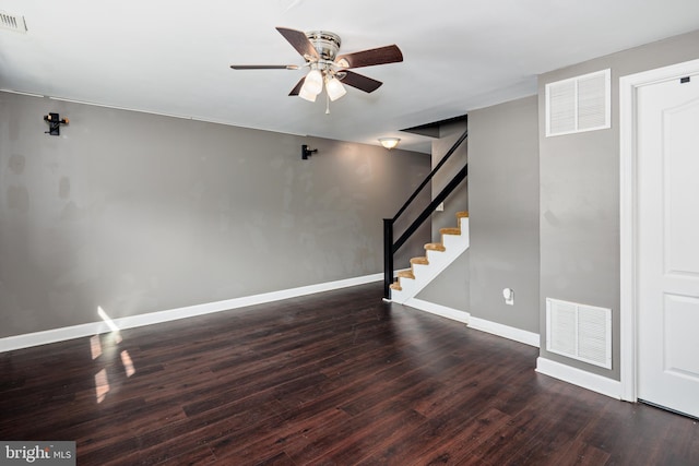 below grade area with stairs, wood finished floors, and visible vents