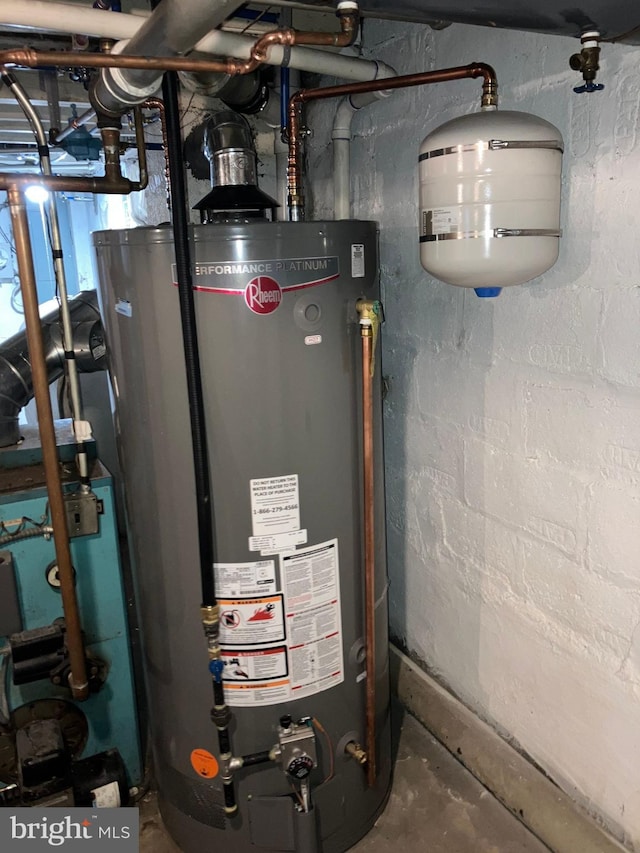 utility room with gas water heater