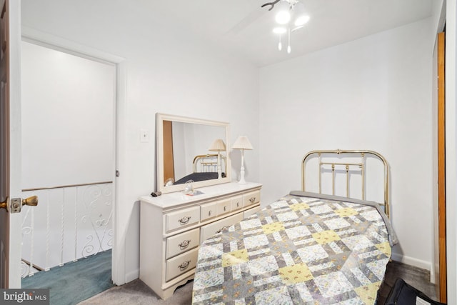 carpeted bedroom with baseboards