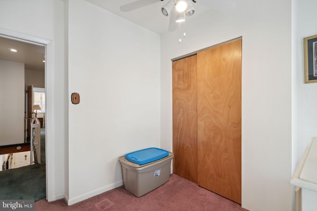 carpeted bedroom with a closet, a ceiling fan, and baseboards