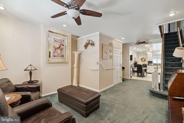 living area with ceiling fan, recessed lighting, carpet floors, baseboards, and stairway