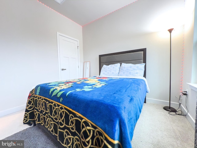 carpeted bedroom with baseboards