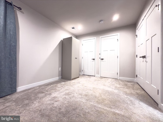 bonus room featuring carpet, visible vents, and baseboards