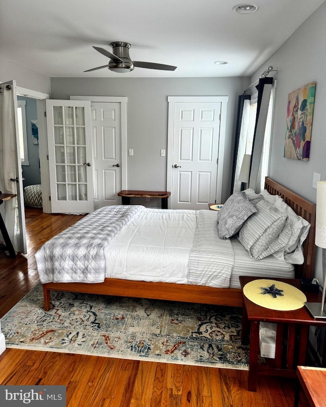 bedroom with ceiling fan and wood finished floors