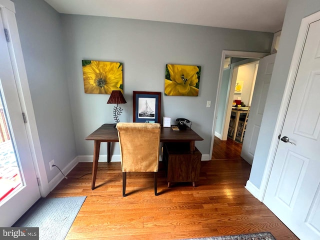 home office with light wood finished floors and baseboards