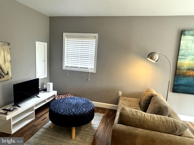 home office featuring baseboards and wood finished floors