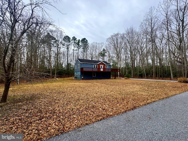 view of yard with a wooden deck