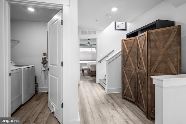 washroom with laundry area, visible vents, independent washer and dryer, light wood-type flooring, and recessed lighting