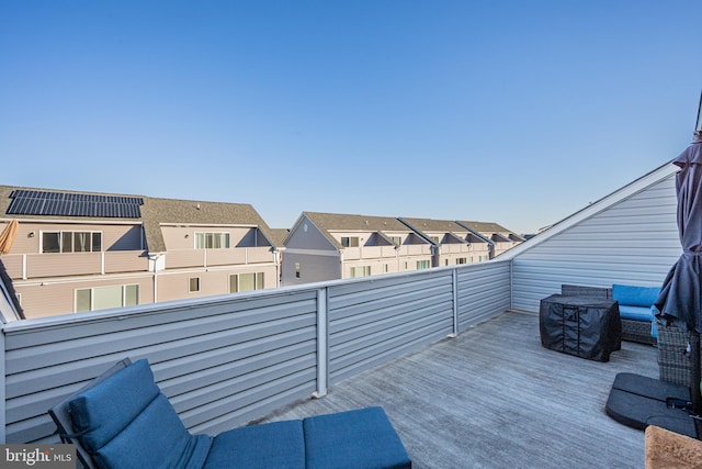 wooden terrace with a residential view