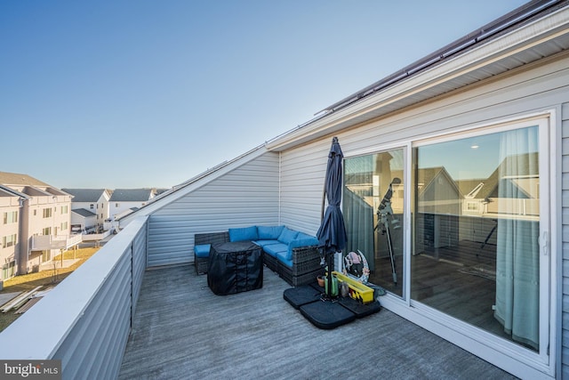 wooden terrace featuring a residential view and an outdoor living space