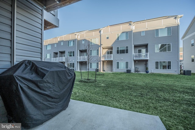 view of property's community with a residential view and a yard