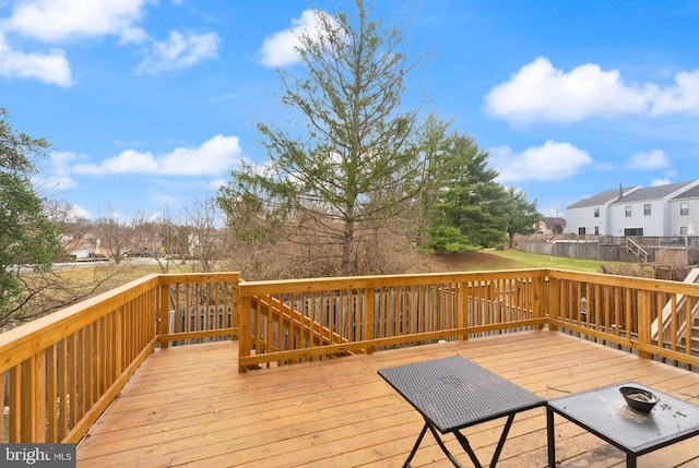 wooden terrace with a residential view