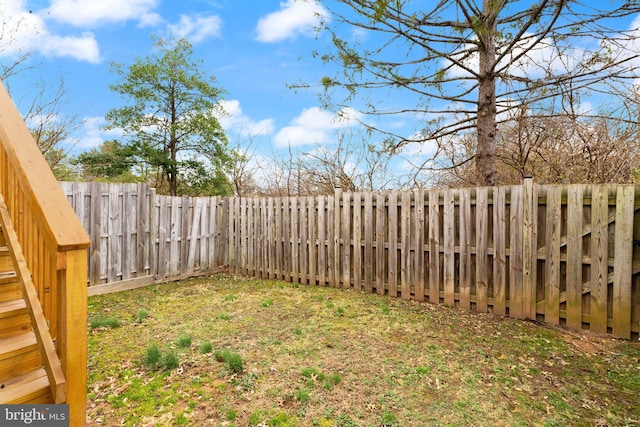 view of yard with a fenced backyard