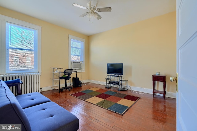 611 E 37th St, Baltimore, MD 21218 - living room with hardwood / wood-style flooring, radiator heating unit, baseboards, and ceiling fan