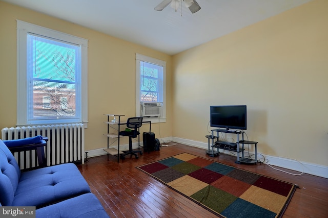 611 E 37th St, Baltimore, MD 21218 - living area featuring hardwood / wood-style floors, radiator heating unit, ceiling fan, cooling unit, and baseboards