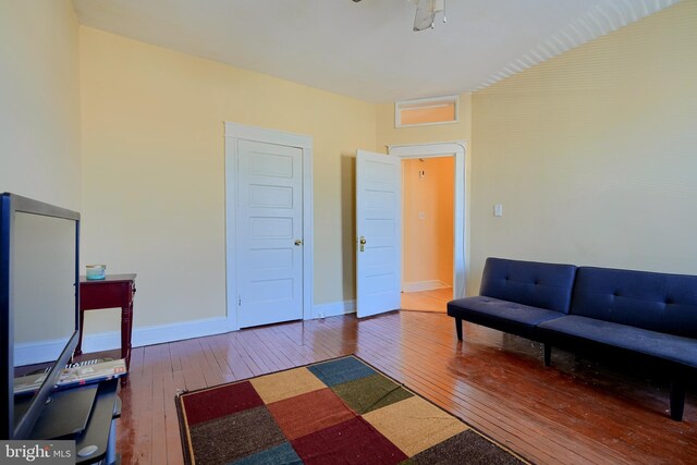 611 E 37th St, Baltimore, MD 21218 - interior space featuring wood-type flooring and baseboards