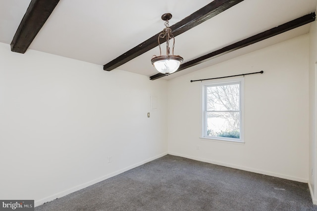 empty room featuring baseboards, dark carpet, and vaulted ceiling with beams