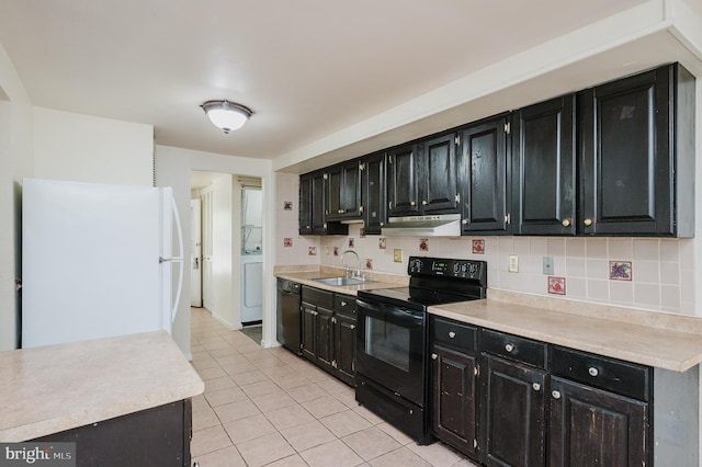 kitchen featuring a sink, black appliances, dark cabinetry, and under cabinet range hood