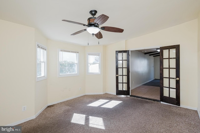 unfurnished room featuring ceiling fan, french doors, baseboards, and carpet