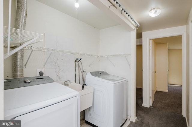 laundry area featuring a sink, separate washer and dryer, tile walls, carpet flooring, and laundry area