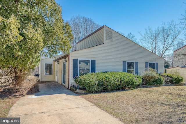 view of side of home featuring a yard