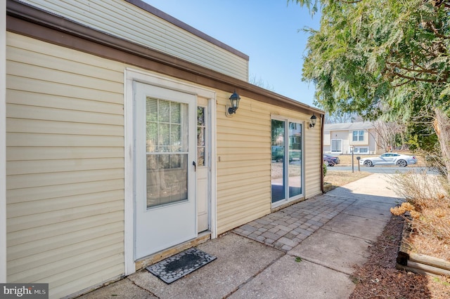 entrance to property with a patio