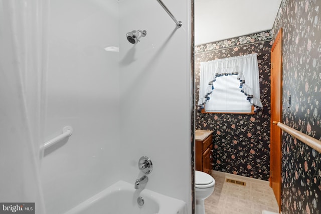 full bath featuring wallpapered walls, visible vents, toilet, bathtub / shower combination, and vanity