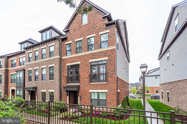 view of front of home with brick siding