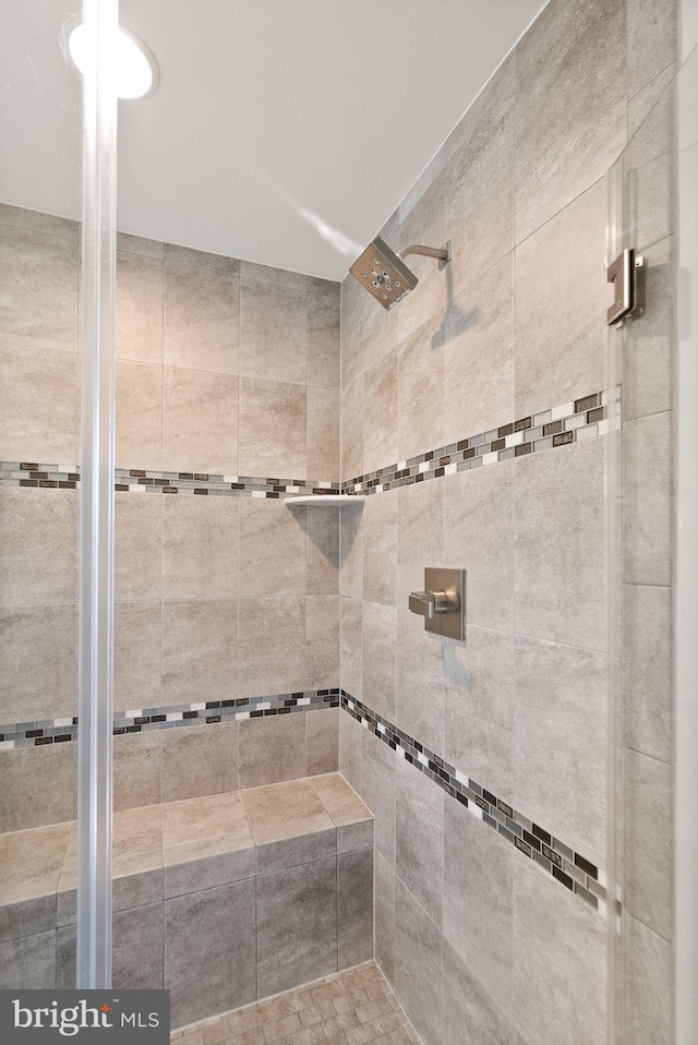 full bathroom featuring a shower stall