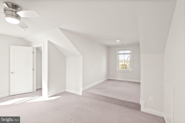 bonus room featuring carpet flooring and baseboards